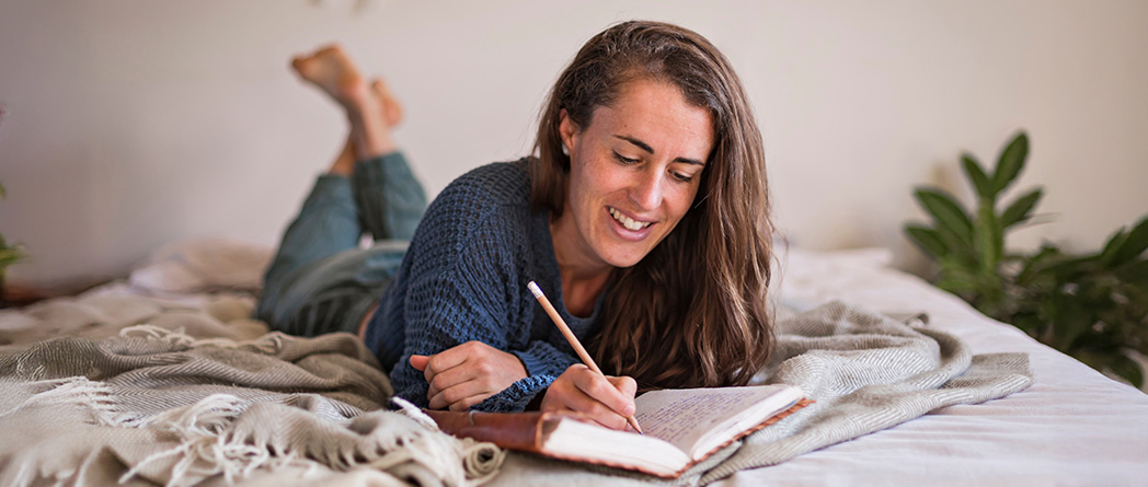 Woman journaling, a CBT technique for addressing negative thoughts