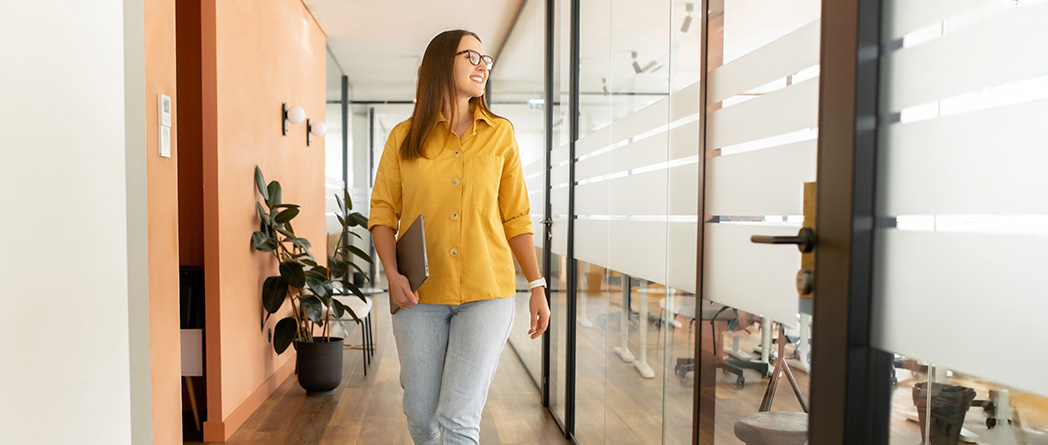 Confident woman walking, symbolizing positive action in CBT