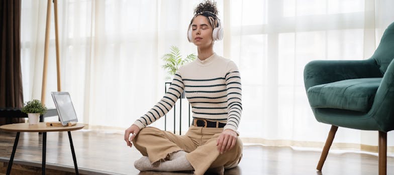 Woman practicing mindfulness at home while listening to music