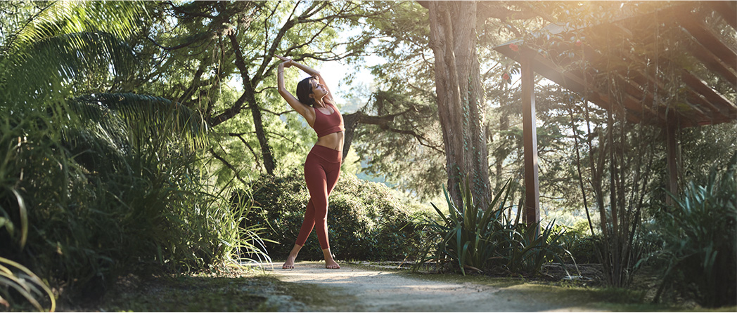 A silhouette of a person stretching