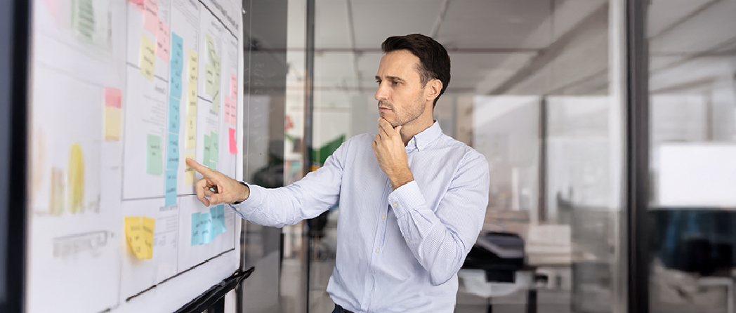 Strategist facing lots of tasks on a board